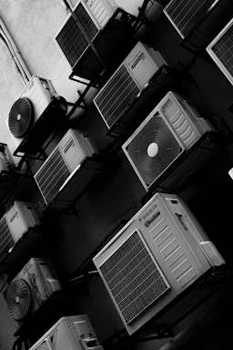 Multiple air conditioning units mounted on a wall