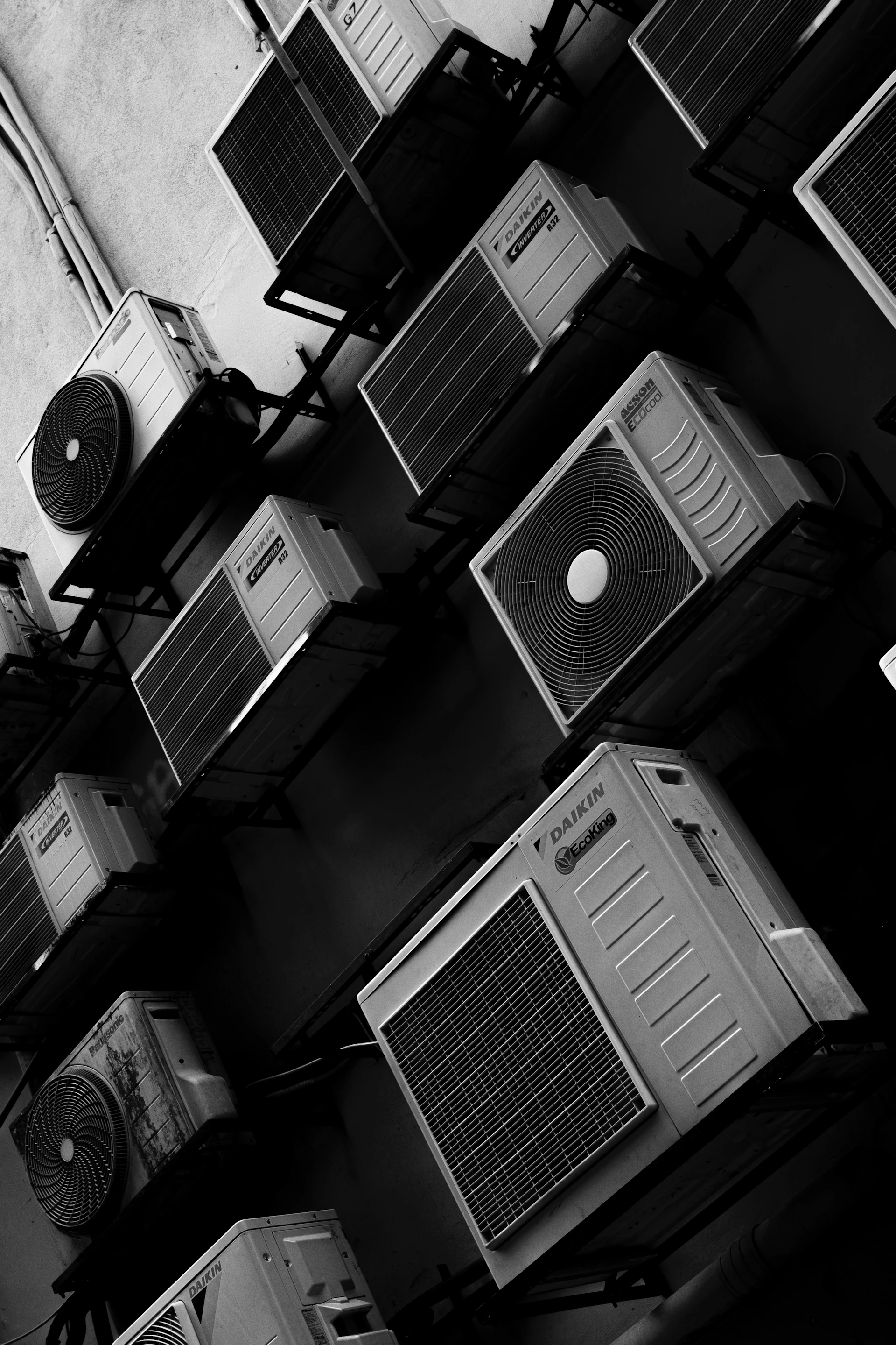 Multiple air conditioning units mounted on a wall