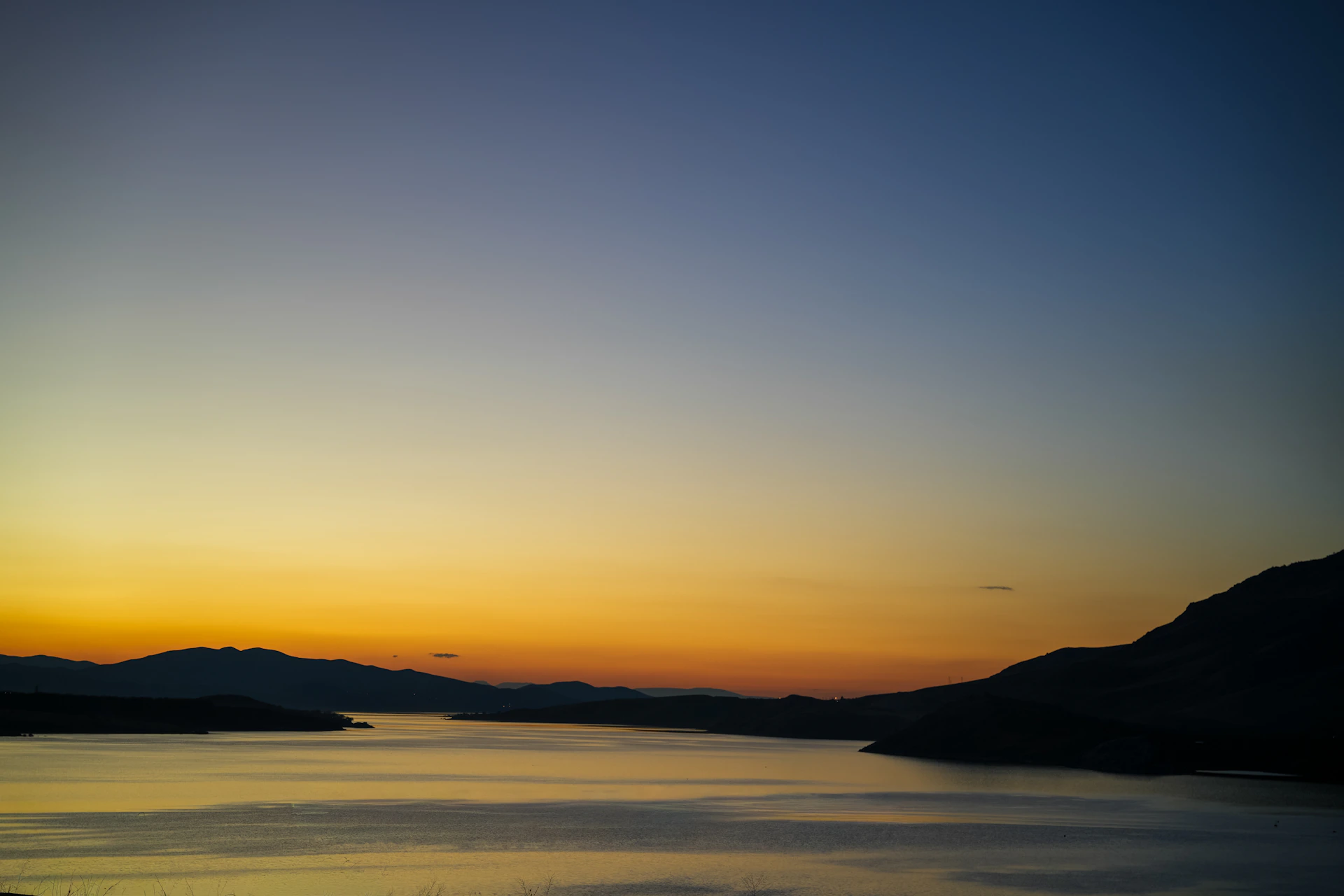 Sunset over a calm body of water
