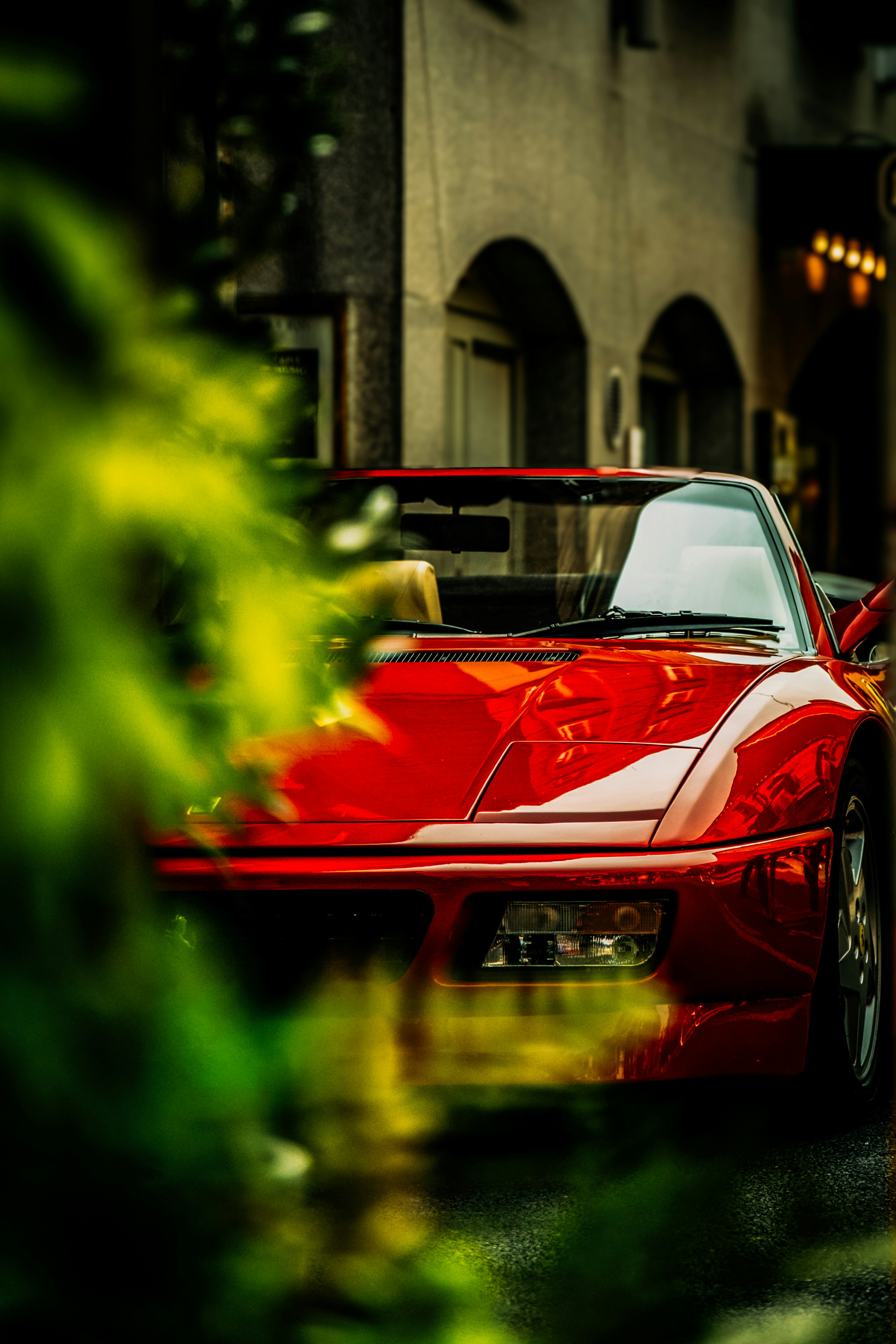 A red sports car parked on a street