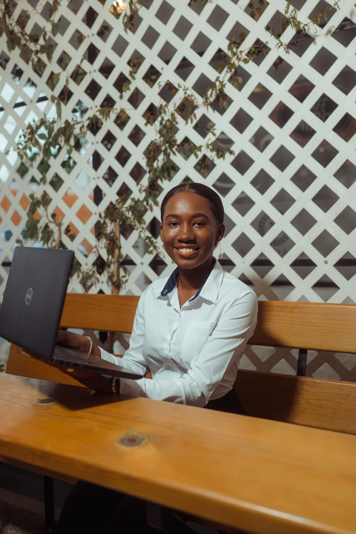 Black analyst reviewing AI-generated business insights on a screen in Nairobi