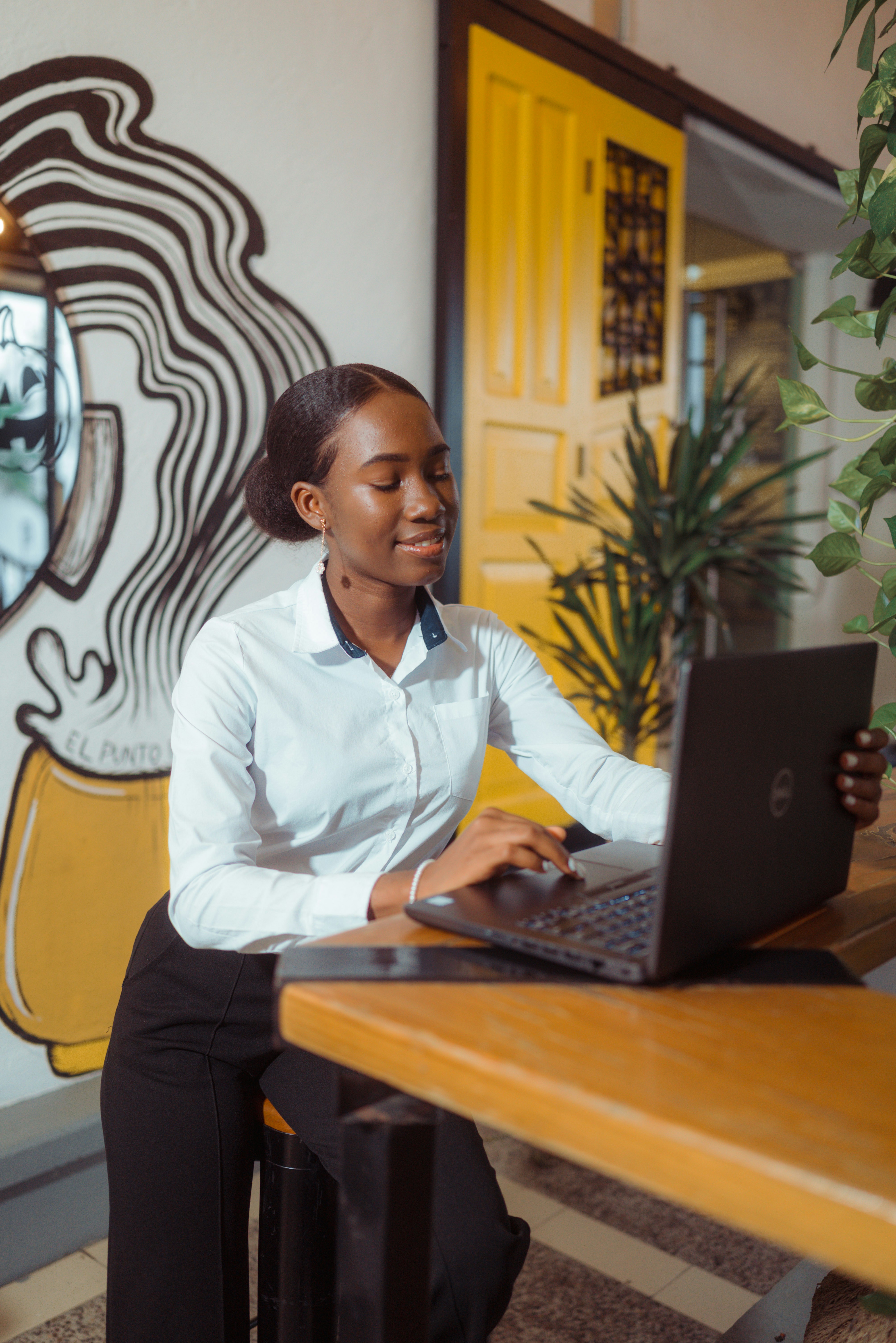 Sarah Jenkins, Operations Director, working on a laptop