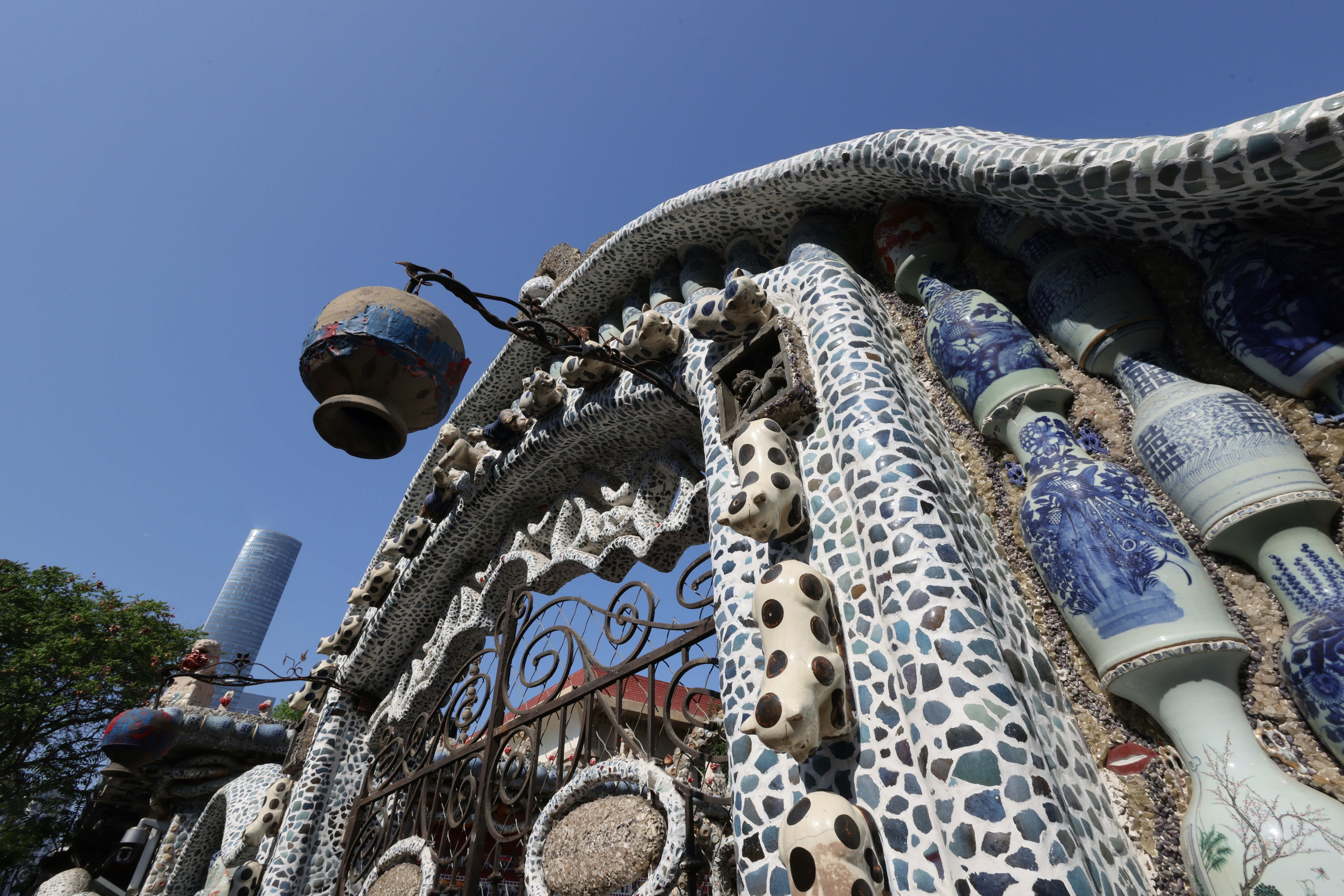 Ornate building facade decorated with ceramic pottery and tiles.