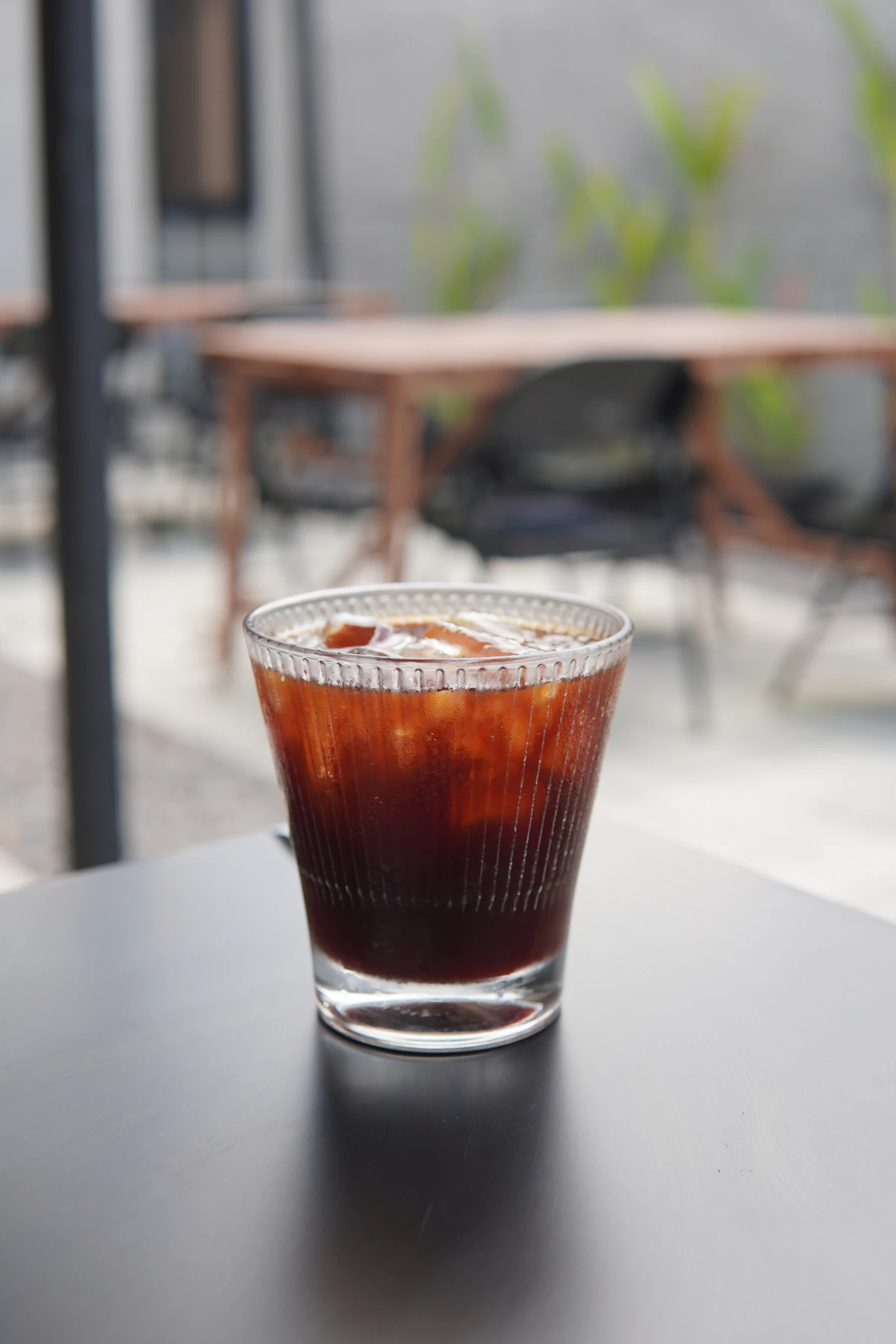 Cold brew coffee served over ice in a clear glass