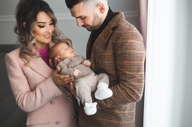 Parents holding their newborn baby son