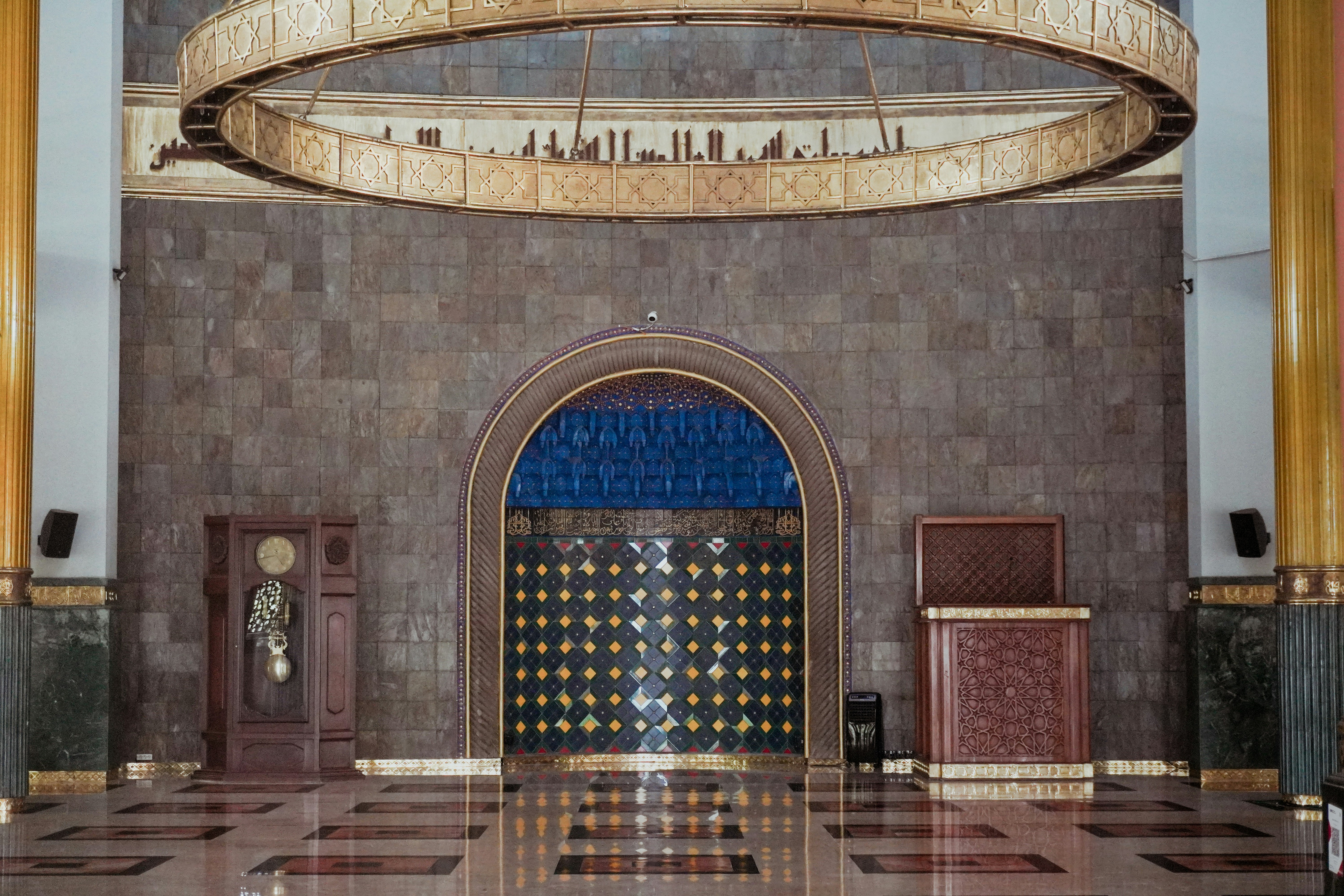 Grand chandelier above ornate mosque entrance