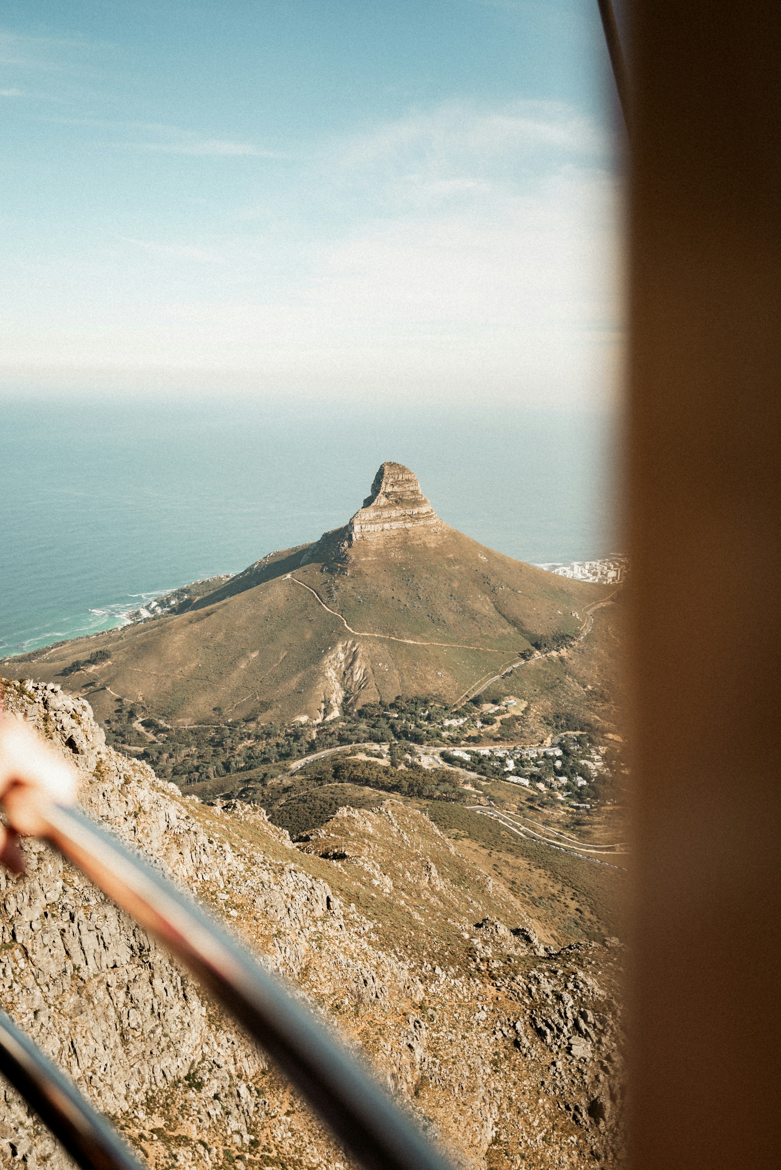 Mountain peak overlooking the ocean and coastline.