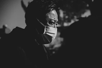 Man wearing a face mask in black and white