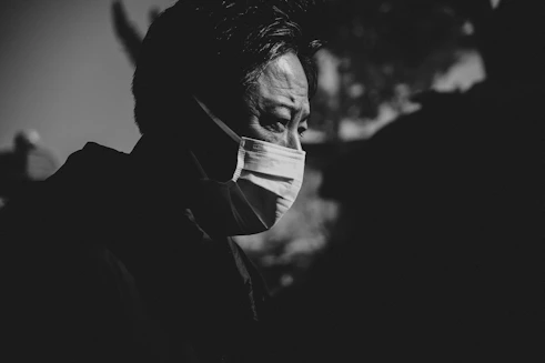 Man wearing a face mask in black and white