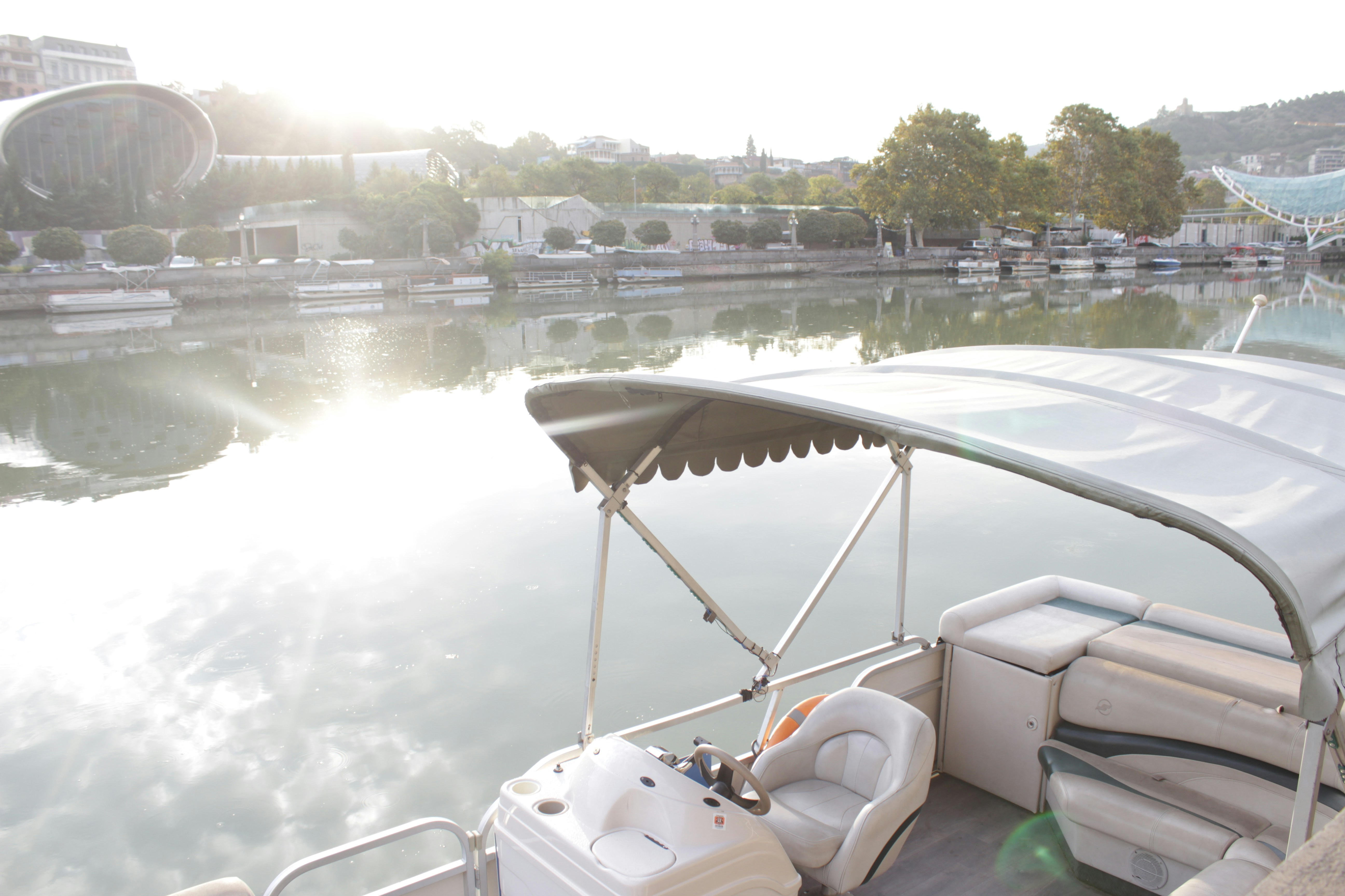 catamaran vs pontoon activity day with ladder deployed, rods stowed safely, and tow line secured.