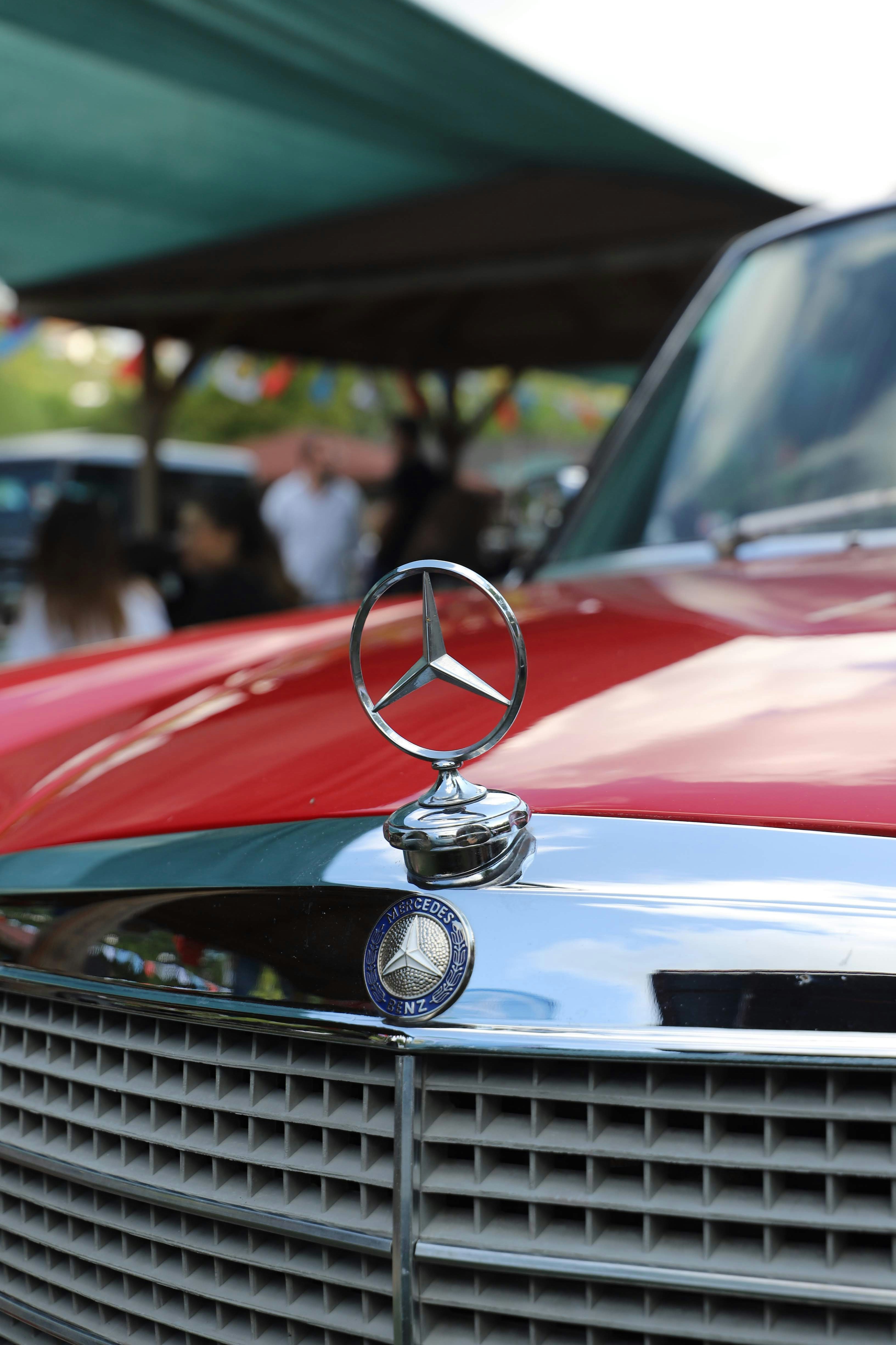 Close-up of a vintage red mercedes-benz car grille