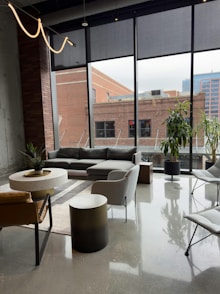 Modern living room with large windows and city view