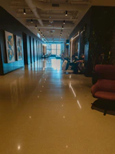 Modern hallway with seating areas and artwork