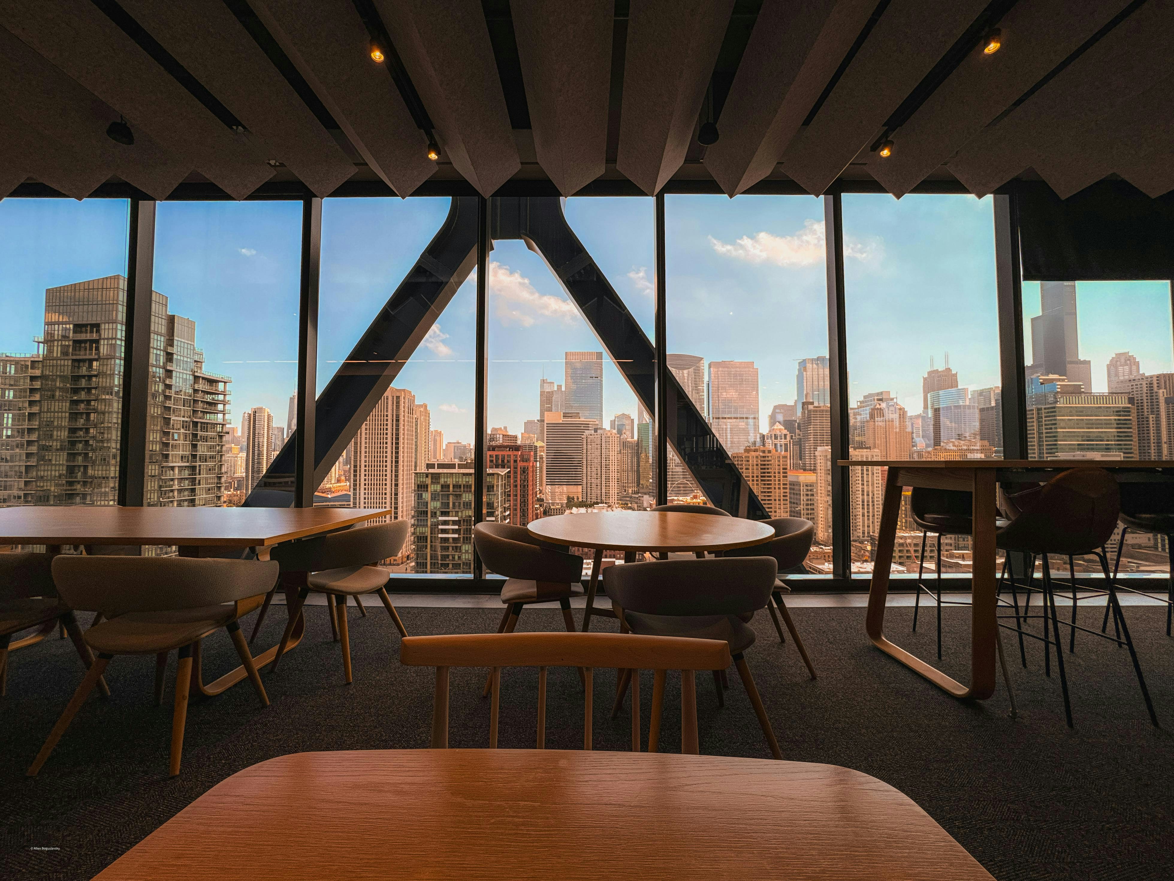 Modern cafe interior with city skyline view
