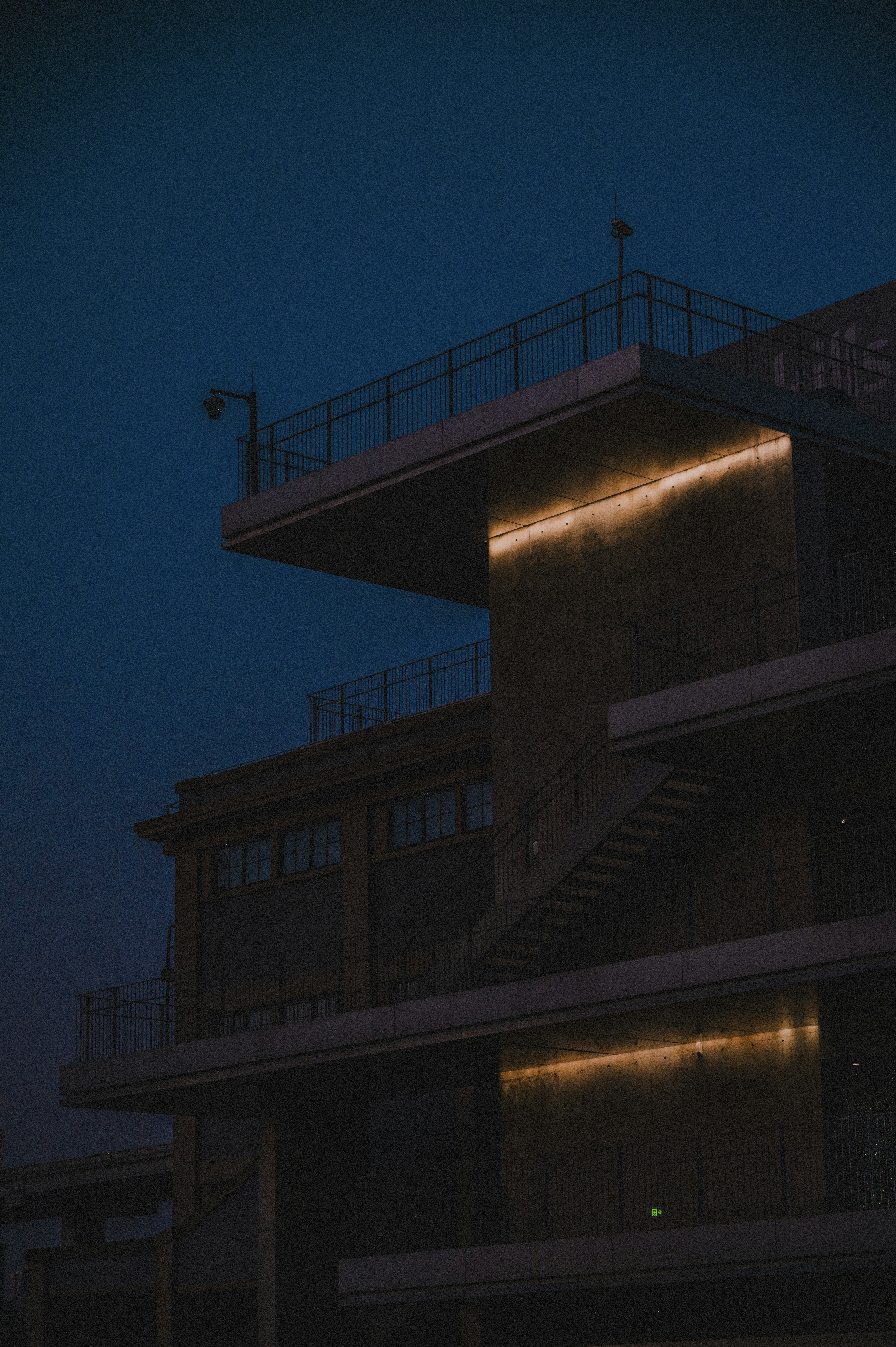 Modern building with illuminated accents at dusk