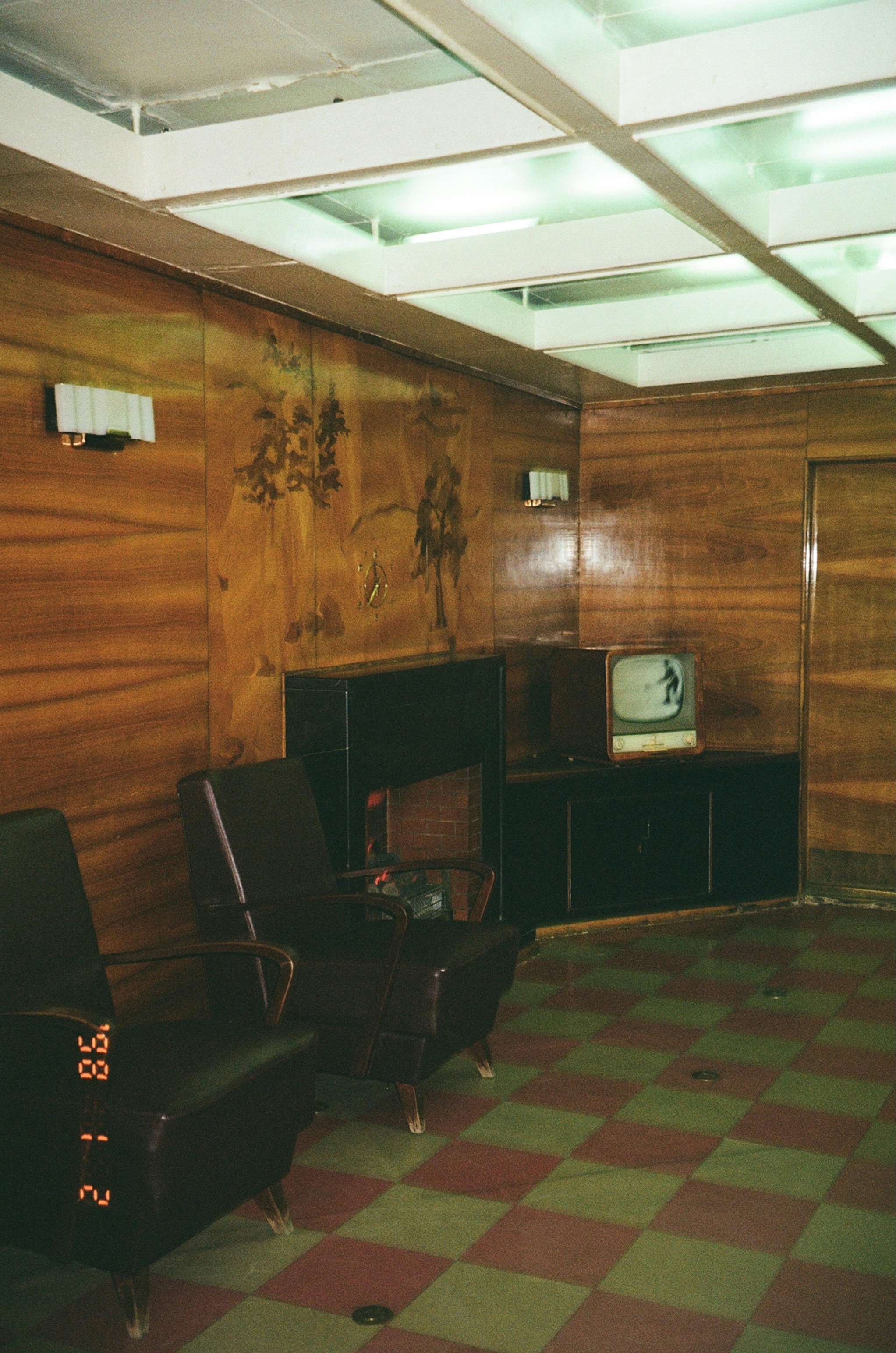 Vintage room with checkered floor and old television