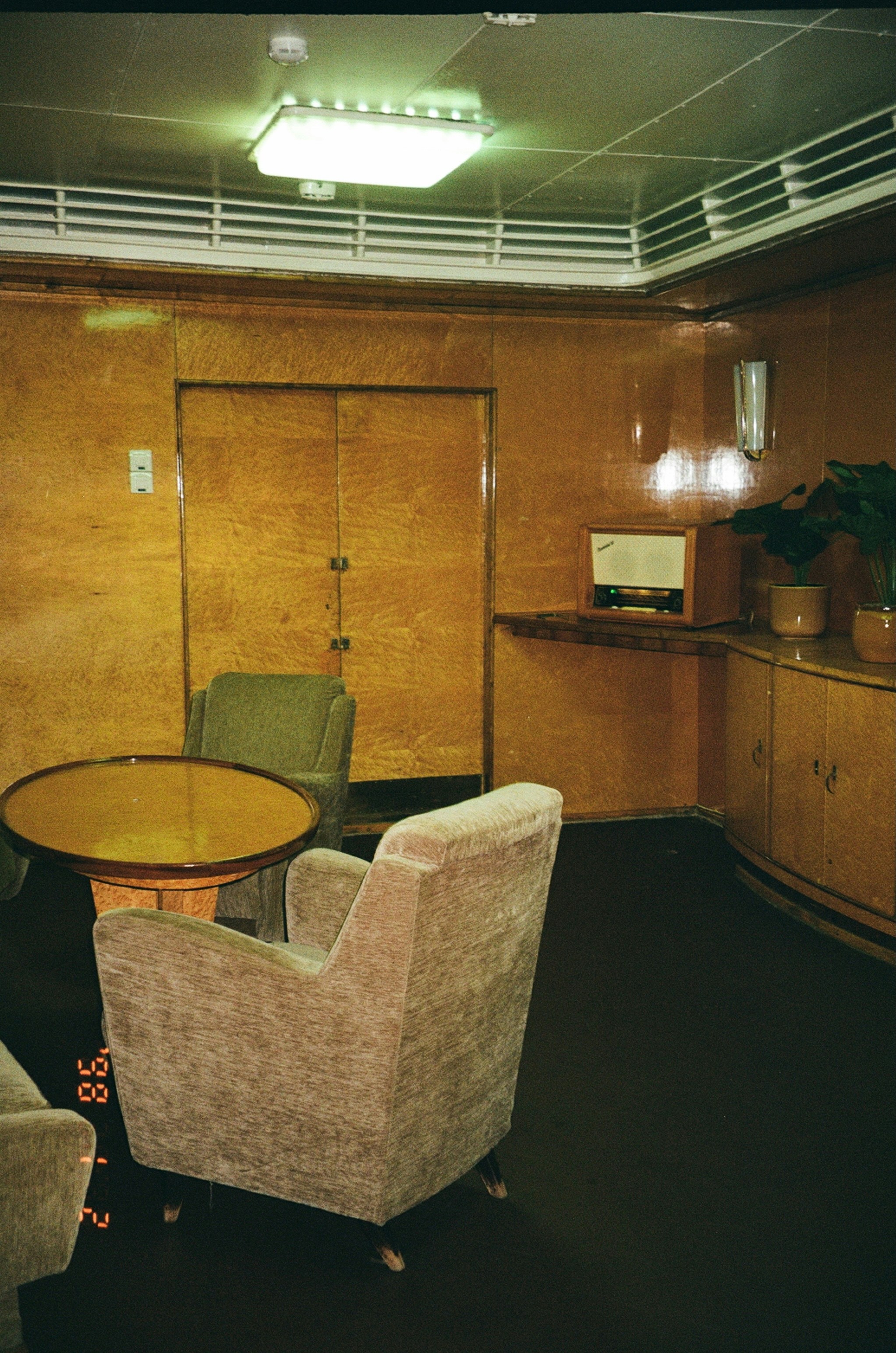 Vintage Lounge Area With Plush Chairs And Wood Paneling.