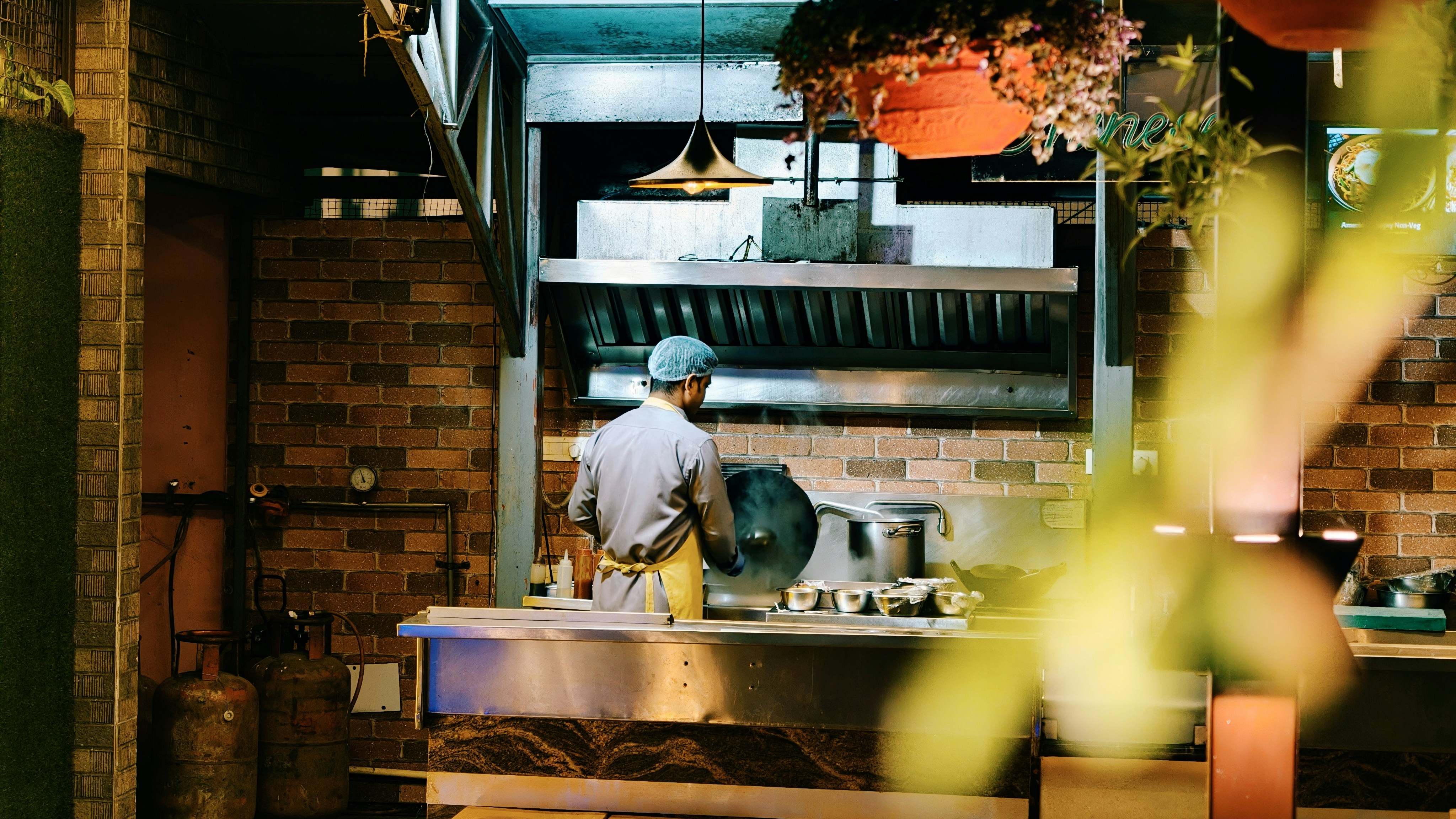 Chef managing steaming pot