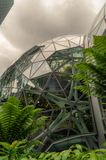 Geodesic dome building with lush green plants