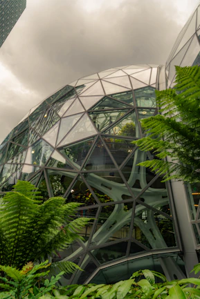 Geodesic dome building with lush green plants