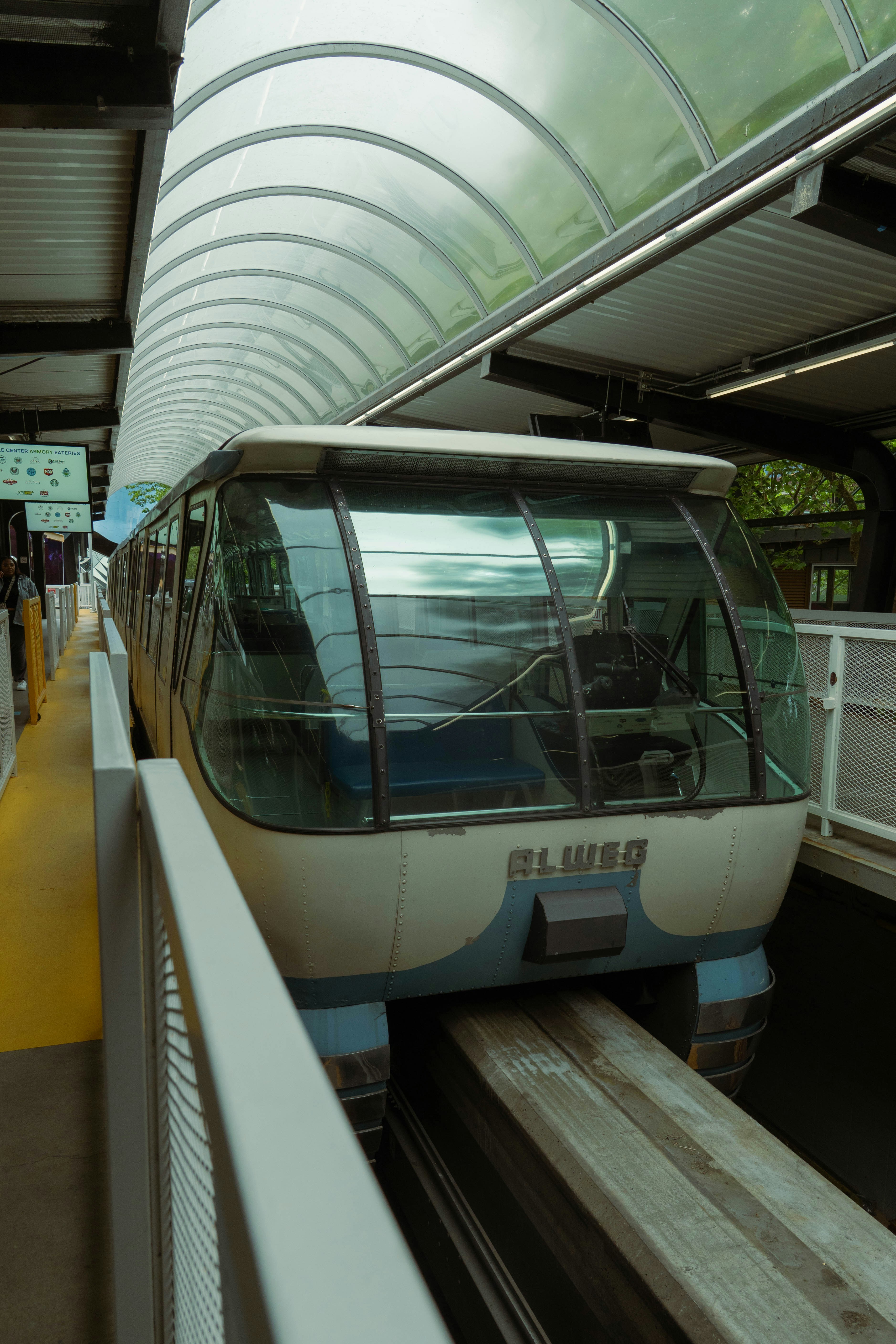 A monorail train at a station platform.