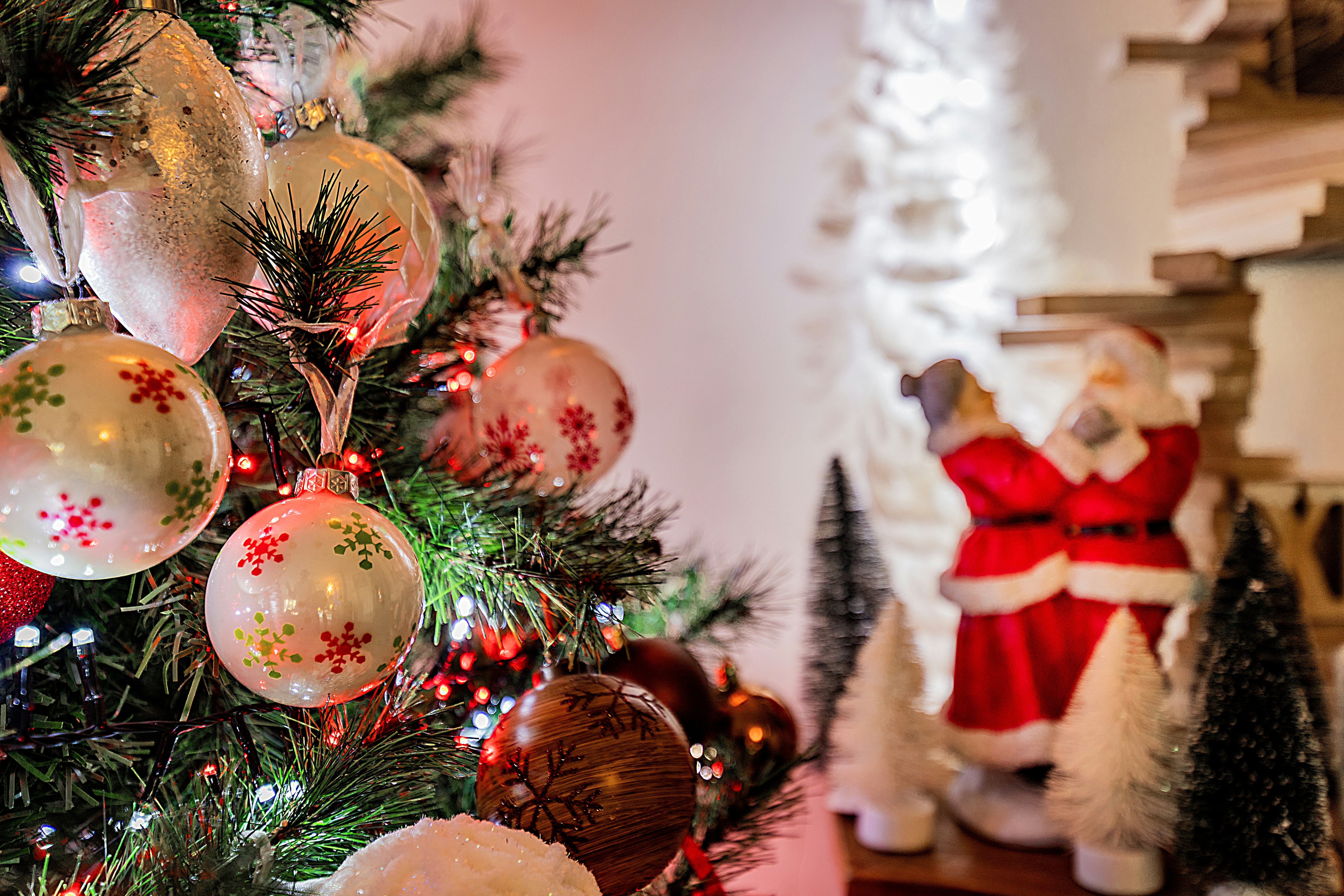 Decorated christmas tree with santa figurine and ornaments