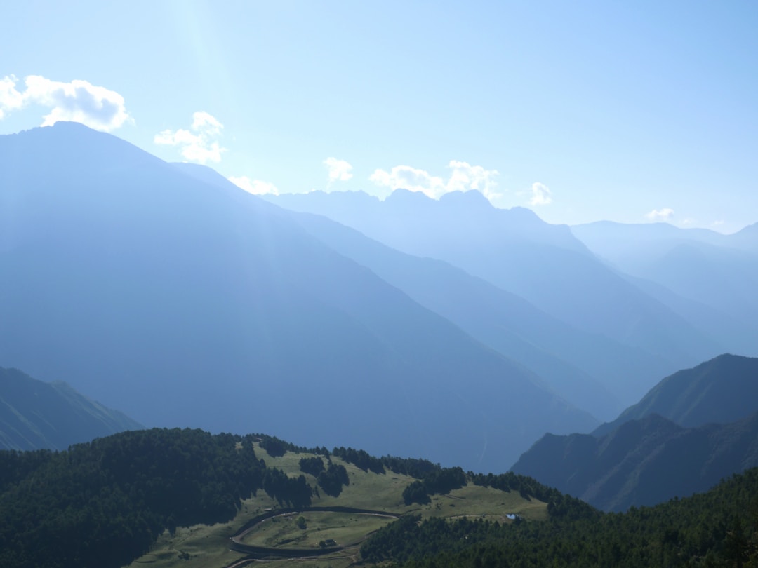 Winding mountain road through scenic valley in western Sichuan