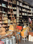 A cluttered hardware store with shelves full of boxes