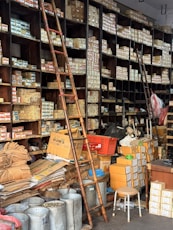 A cluttered hardware store with shelves full of boxes