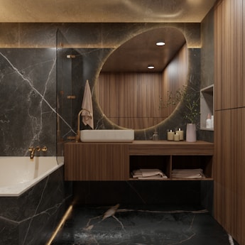 Modern bathroom with marble and wood accents.