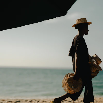 Woman in a straw hat on the shoreline