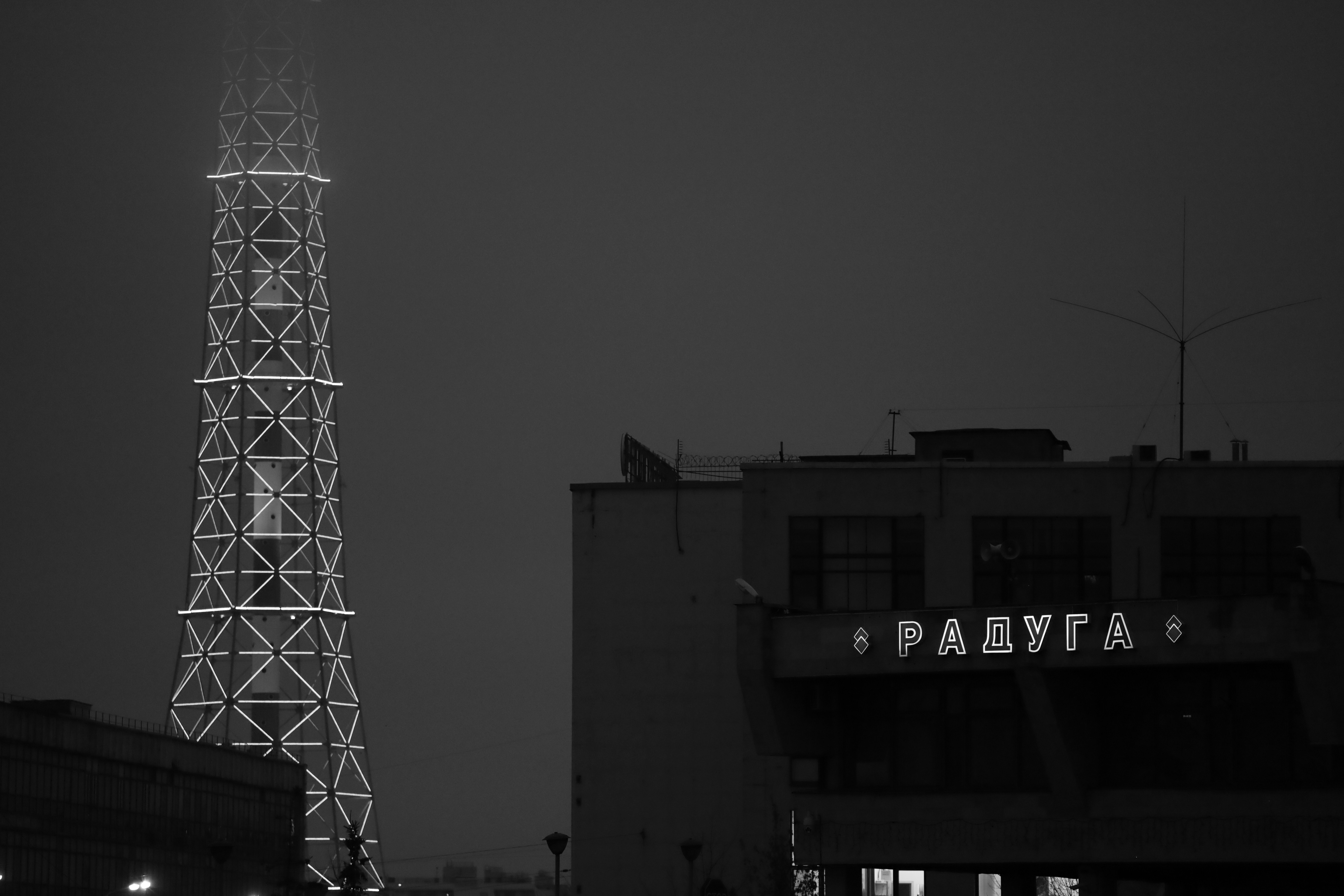 Tall tower with glowing lights in foggy night
