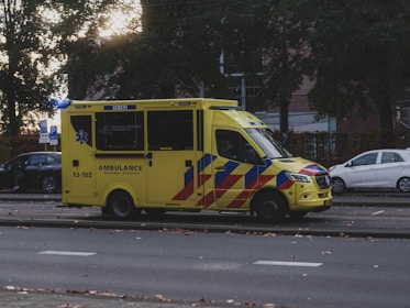 Yellow ambulance parked on the street