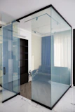 Modern interior with glass walls and blue curtains