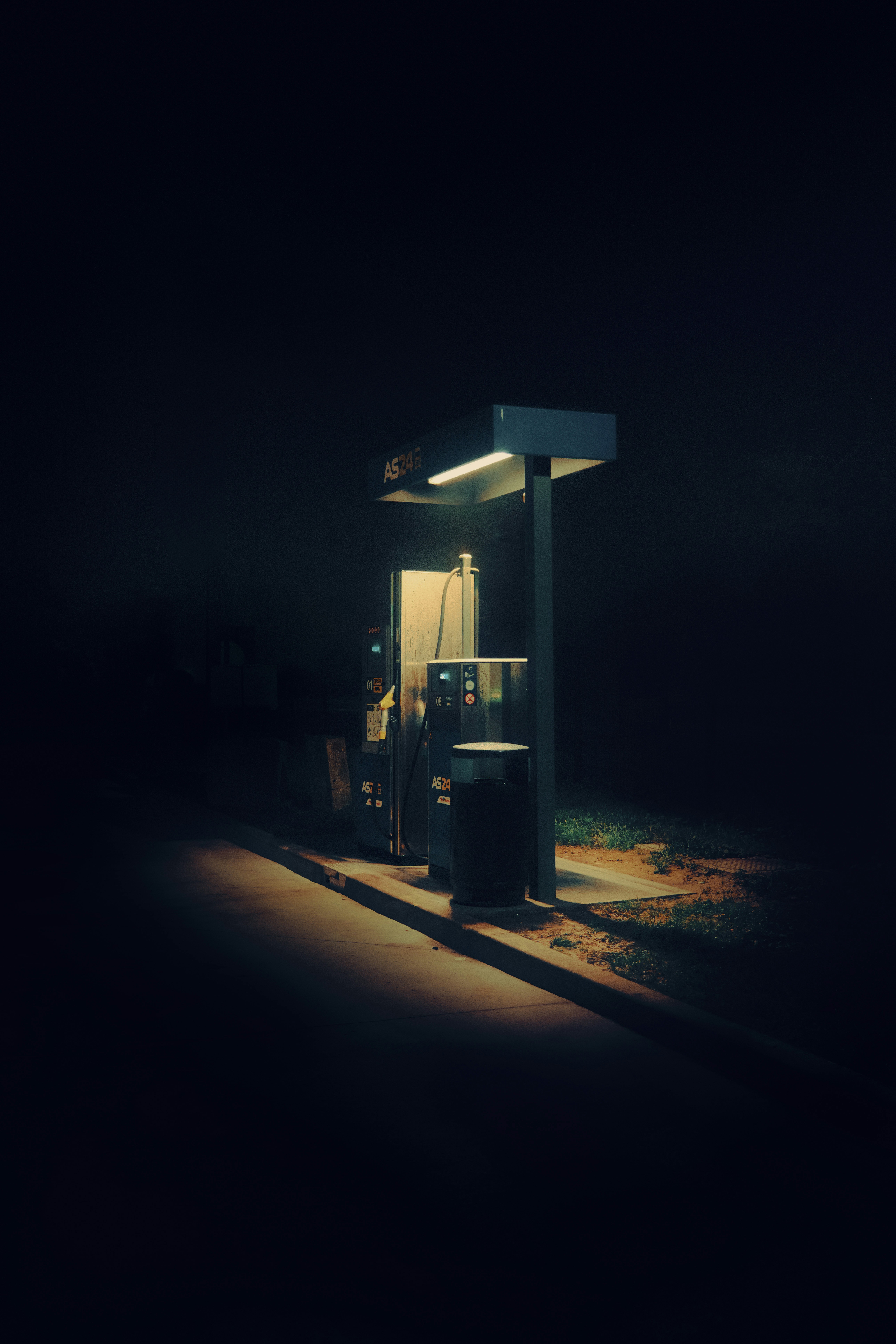 Gas station illuminated at night in darkness