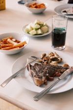 Steak with mushrooms, pasta, and chopped apples
