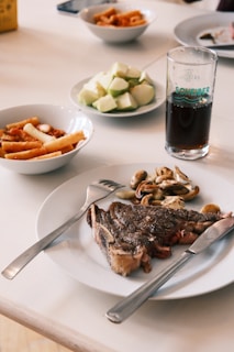 Steak with mushrooms, pasta, and chopped apples