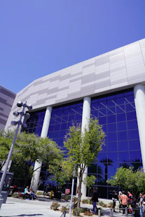 Modern building with large blue windows and trees