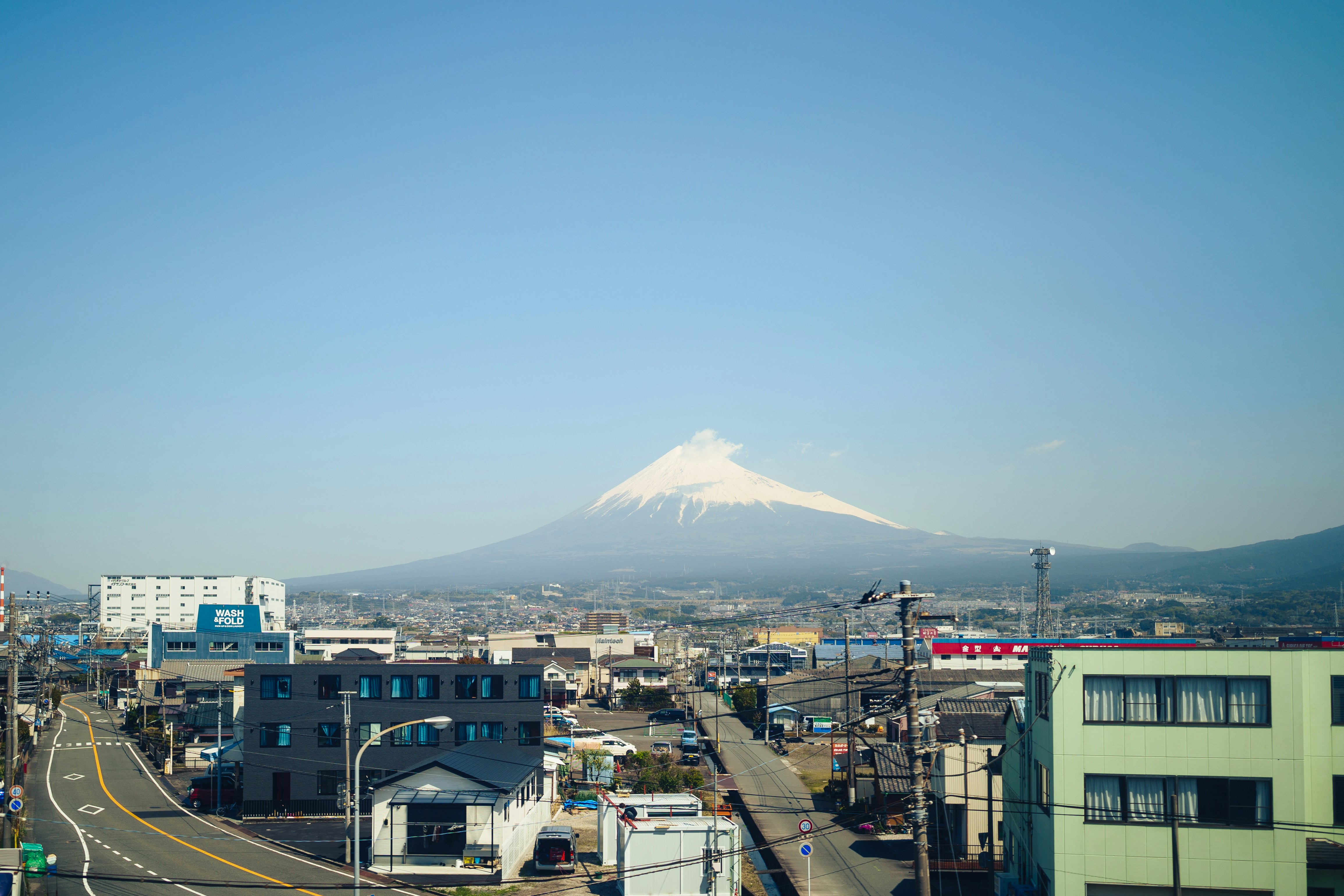 Mount fuji visible over a japanese town