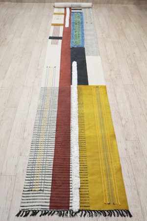 Long colourful runner rug with geometric patterns
