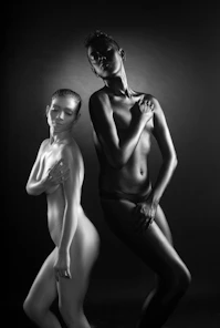 Two women with painted bodies, black and white