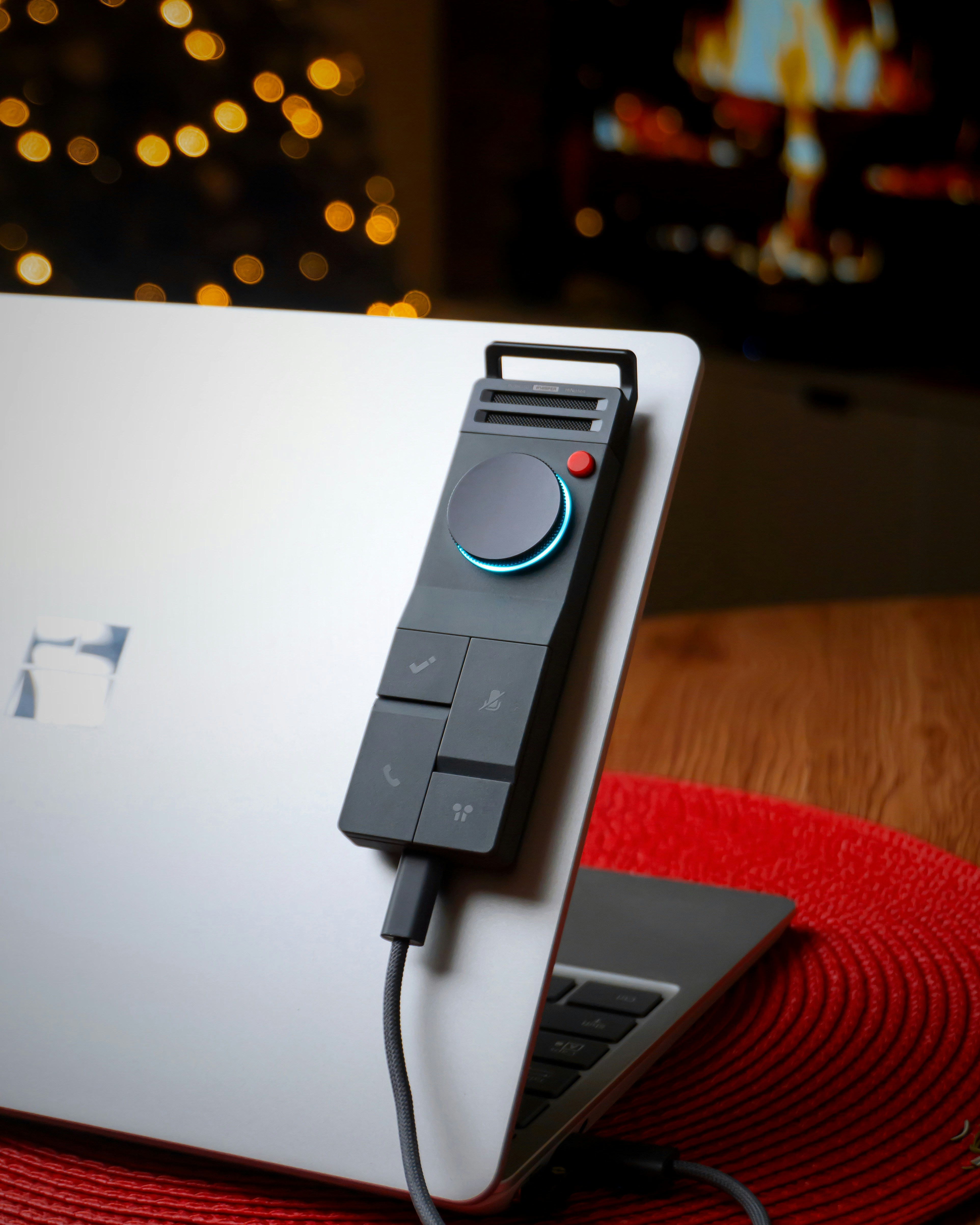 Modern controller attached to a laptop with festive lights