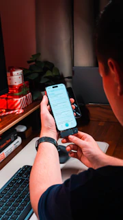 Person holding smartphone with text on screen