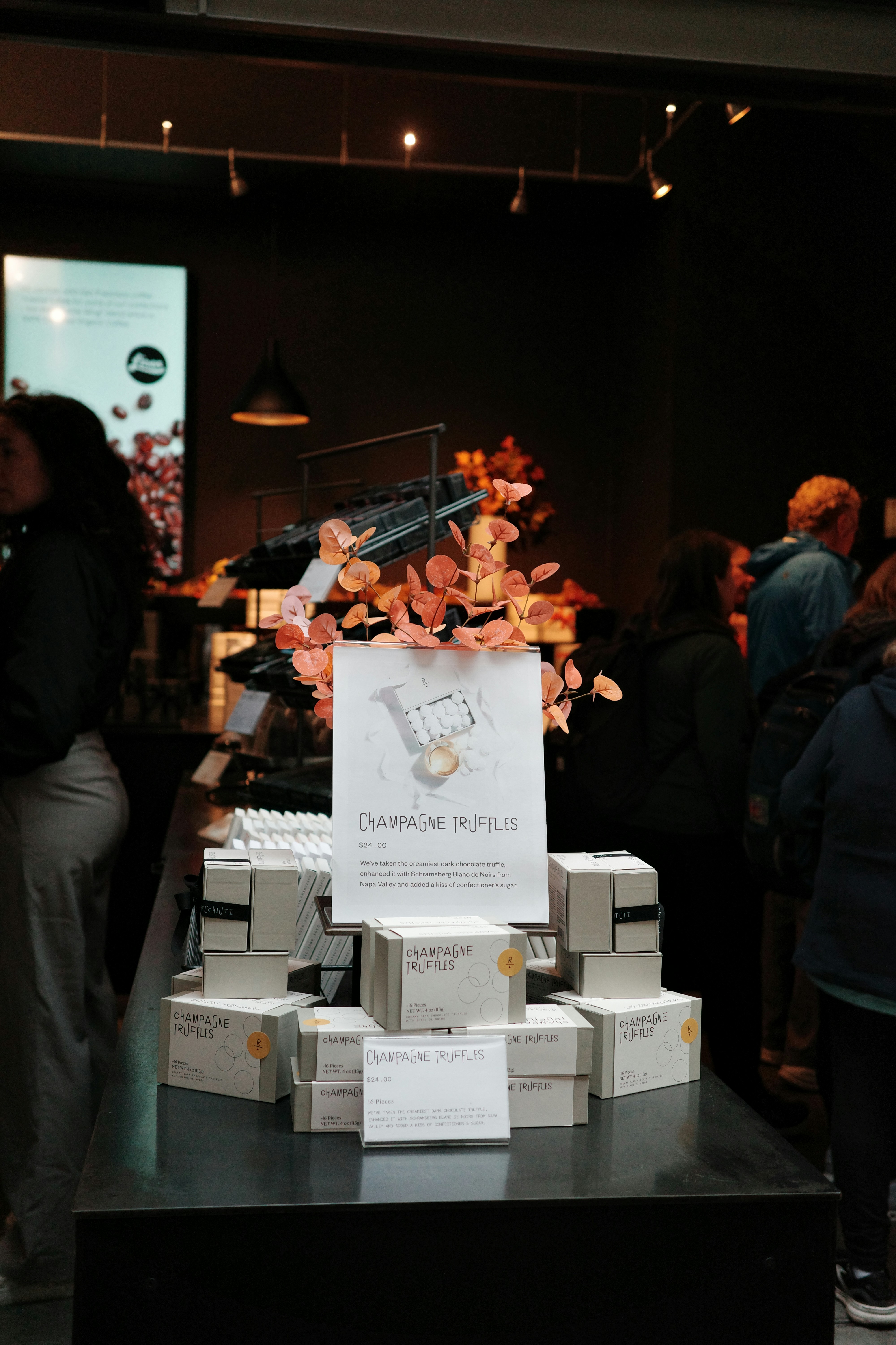 Champagne truffles displayed for sale in a store.