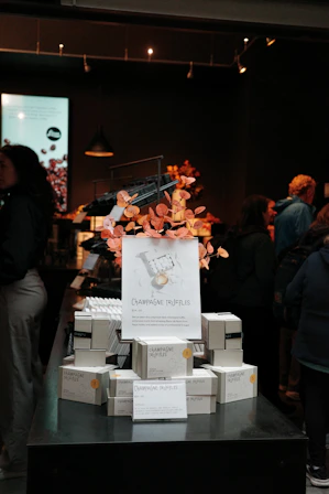 Champagne truffles displayed for sale in a store.
