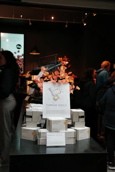 Champagne truffles displayed for sale in a store.