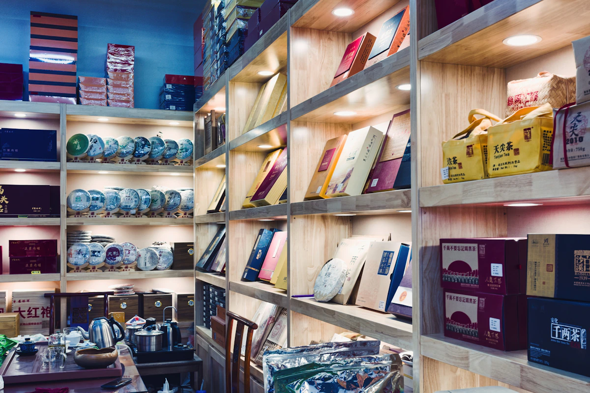 Shelves of carefully packaged tea and ceramic drinkware