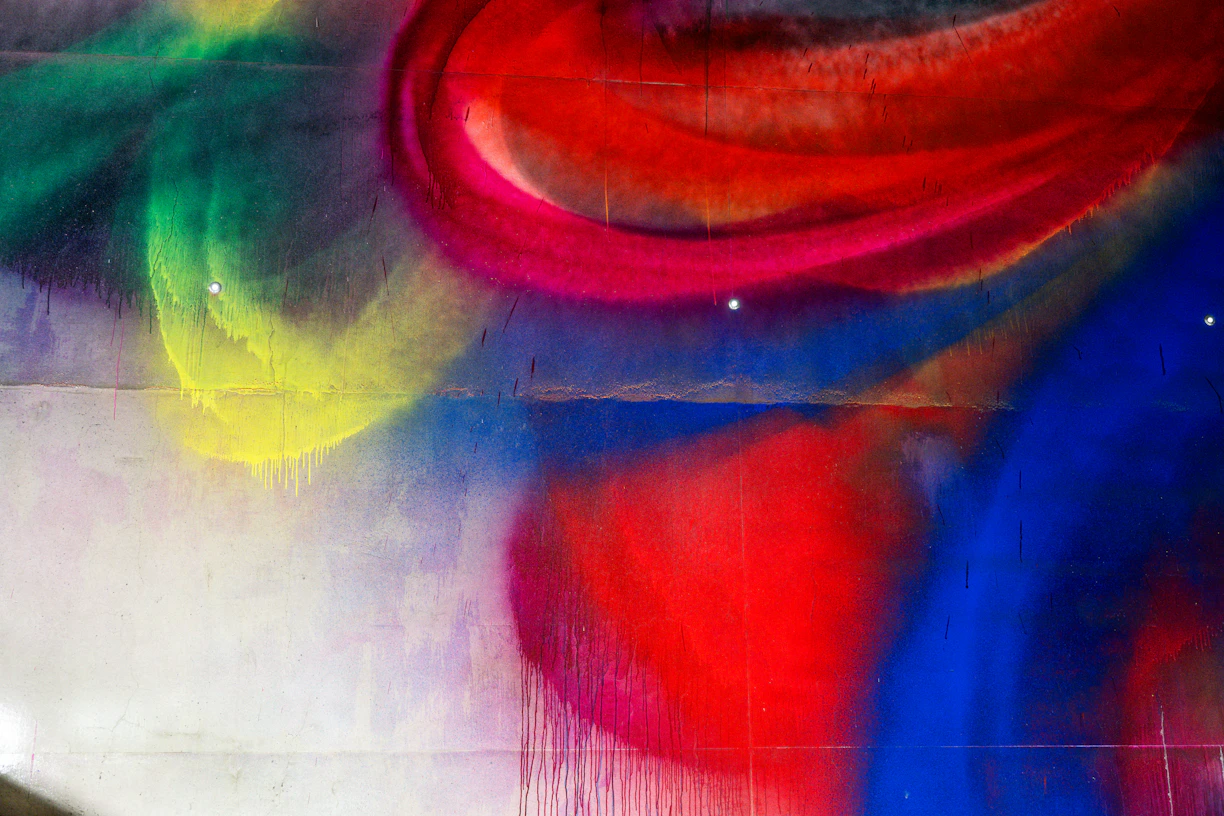 Colorful abstract spray paint art on a wall.