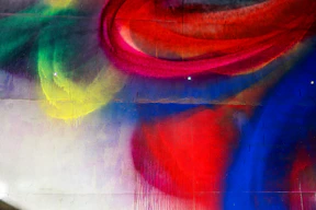 Colorful abstract spray paint art on a wall.