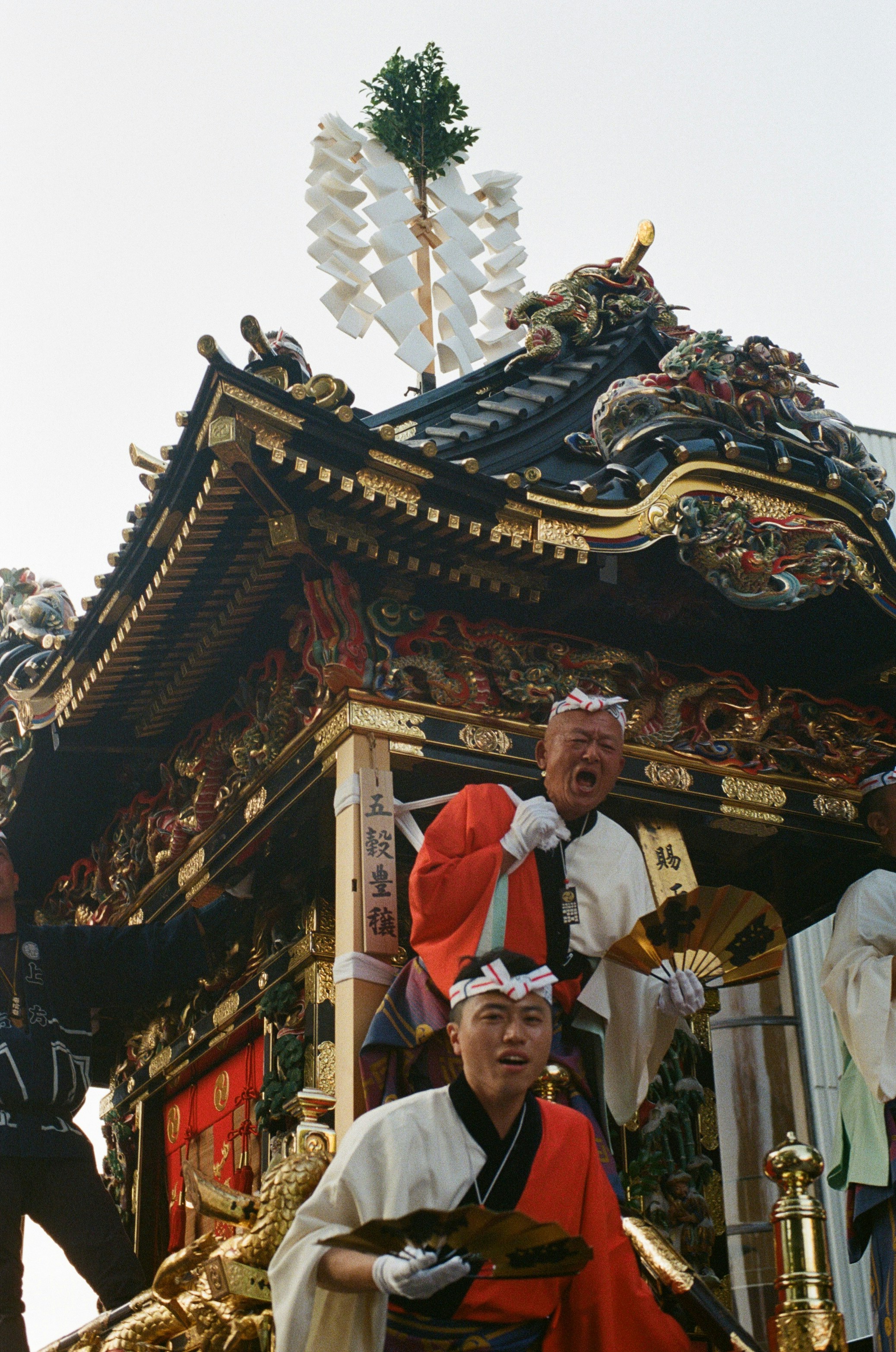 Men in traditional japanese attire on a festival float